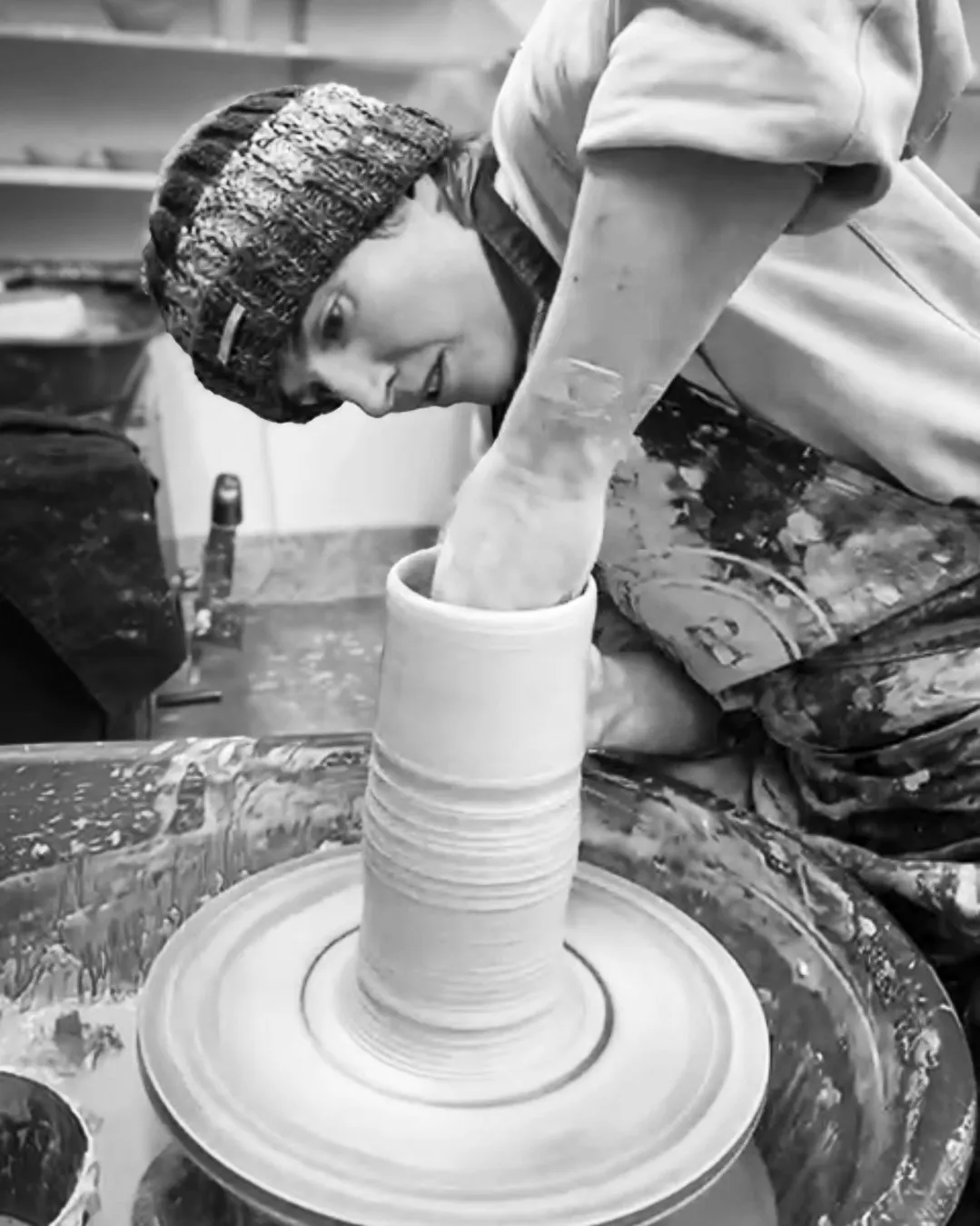 Lucy throwing on the potter's wheel